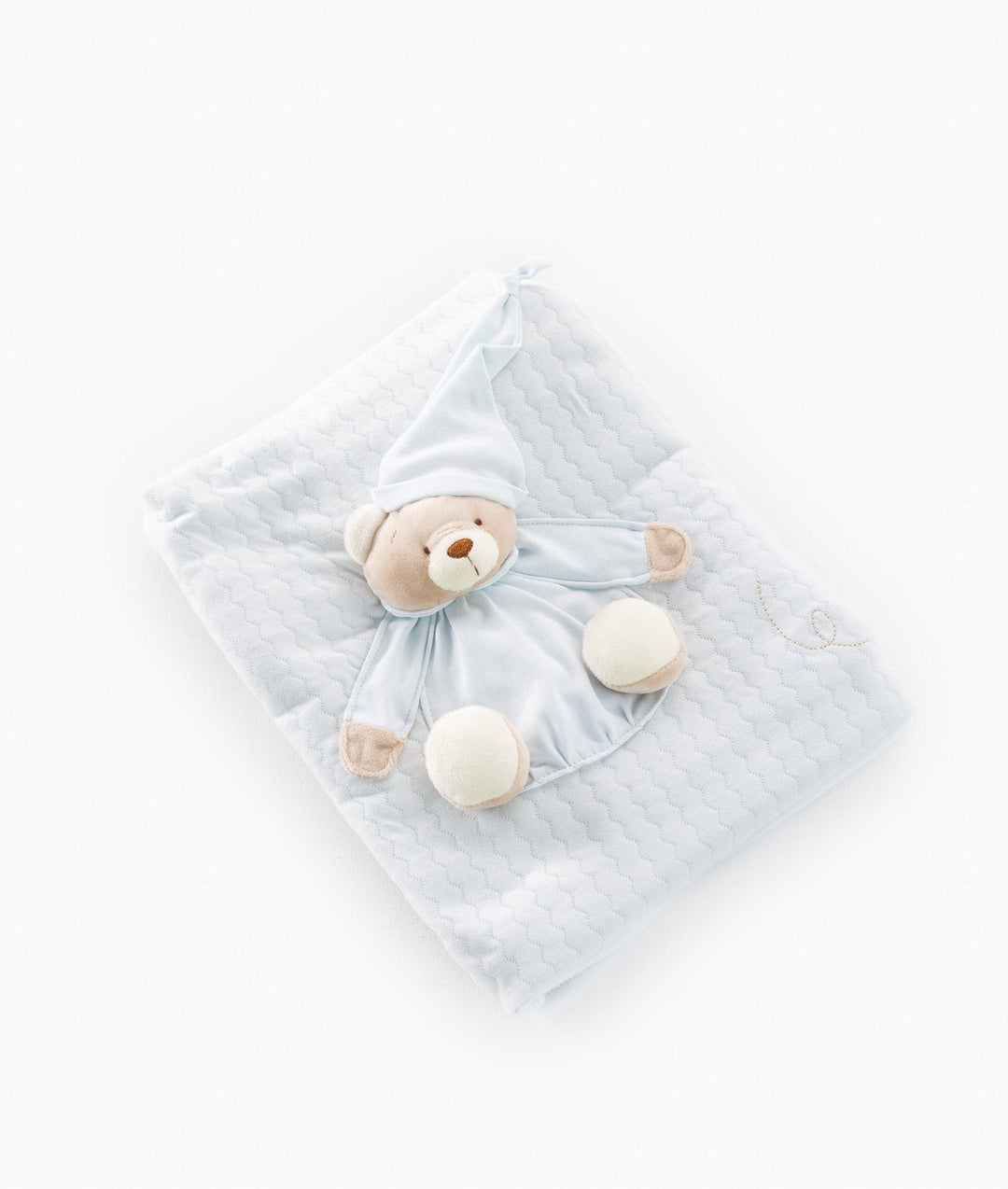Blue nursery blanket with embroidered swirl corner and sleeping bear motif