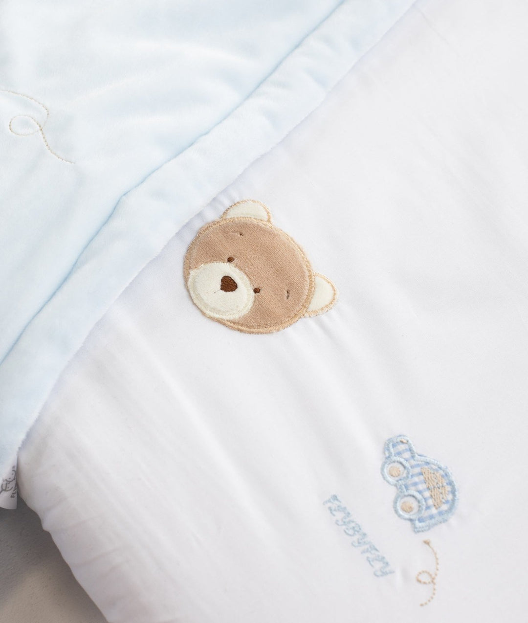 Blue checkered car and brown bear embroidery on white cotton bassinet sheet