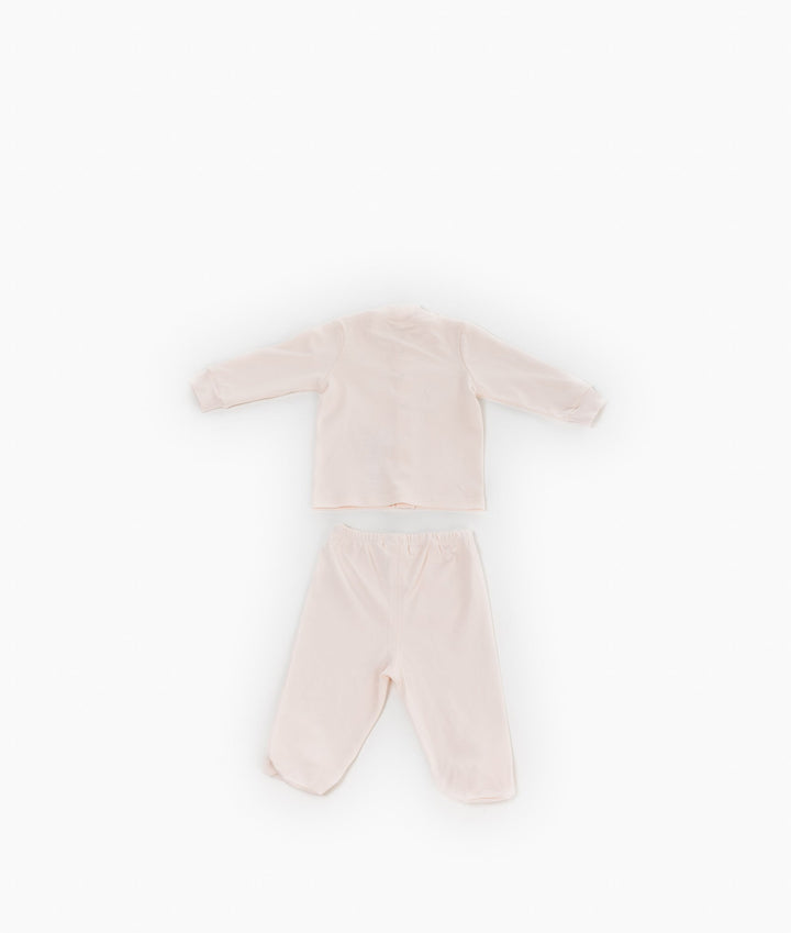Back view of light pink baby pajama set showing plain top and elastic waist trousers