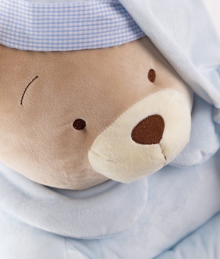 Detail of beige bear face embroidery and blue gingham trim on toddler armchair