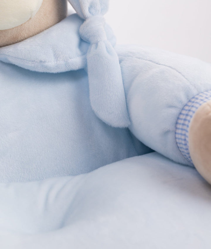 Macro detail of fuzzy microfiber texture and knotted hood tie on baby chair