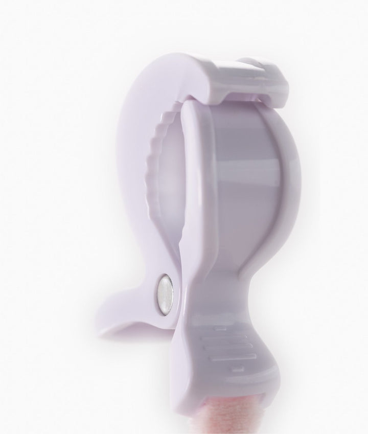 Close-up of white plastic clip hinge for attaching baby toys