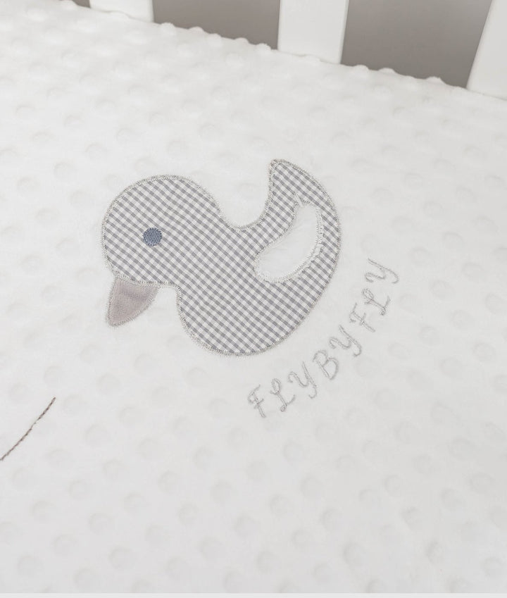 white minky dot fabric with embroidered grey gingham duck and branding
