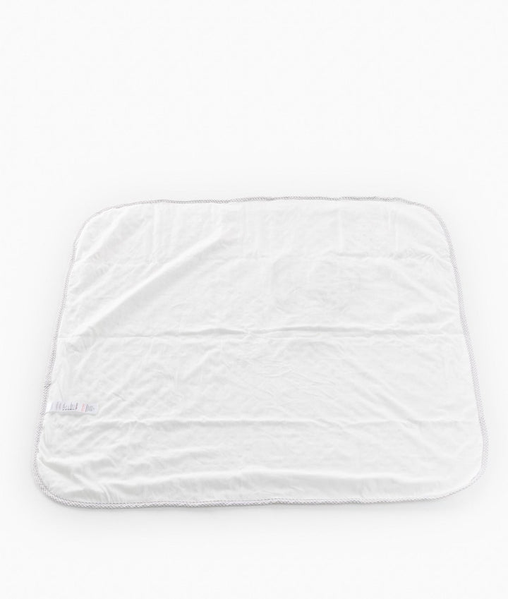 Reverse side of white cotton lining with grey braided trim