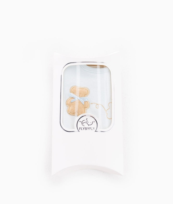 Blue baby bib in white pillow box packaging with FLYBYFLY logo sticker
