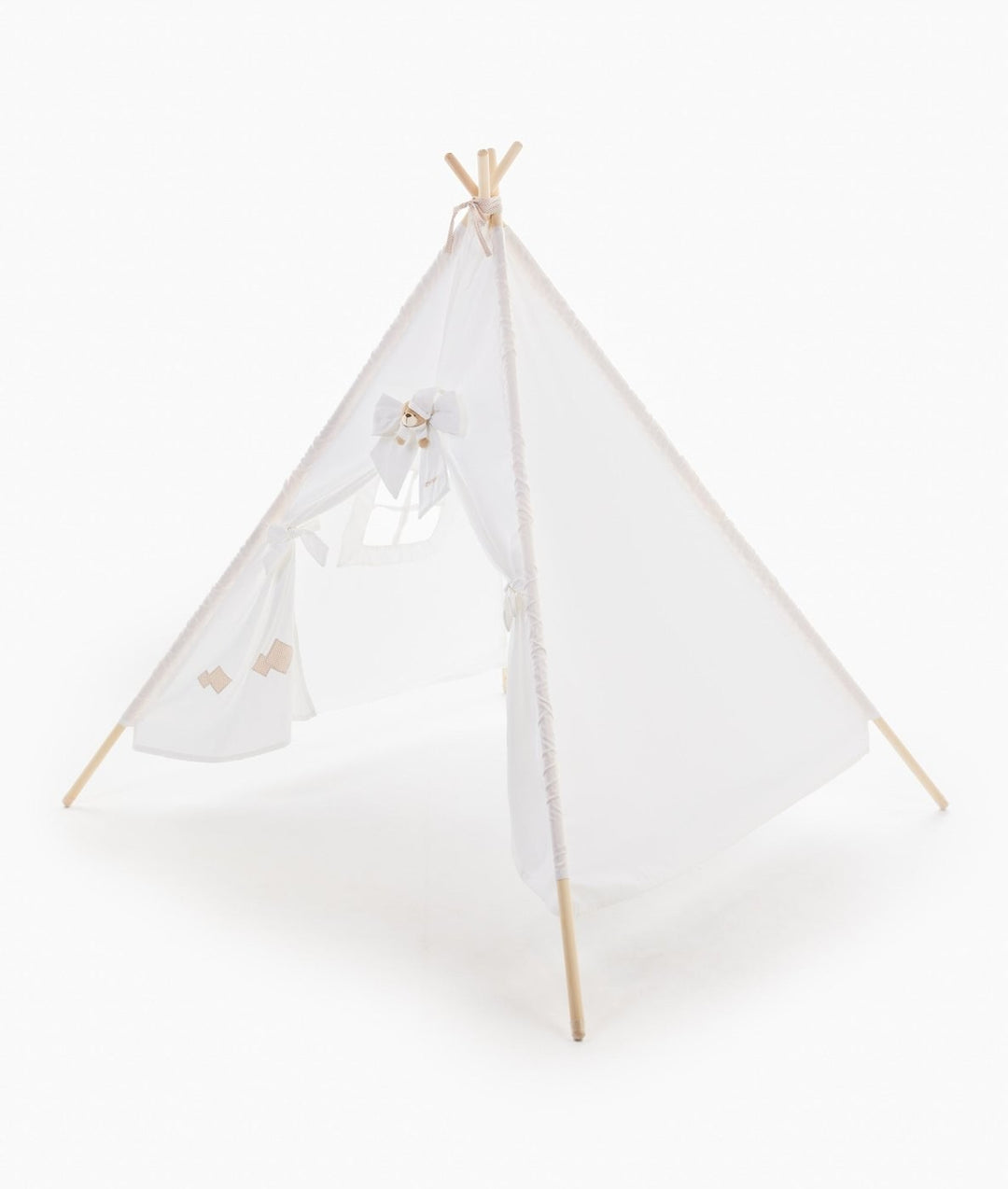 Beige and white teepee tent with geometric embroidery patches
