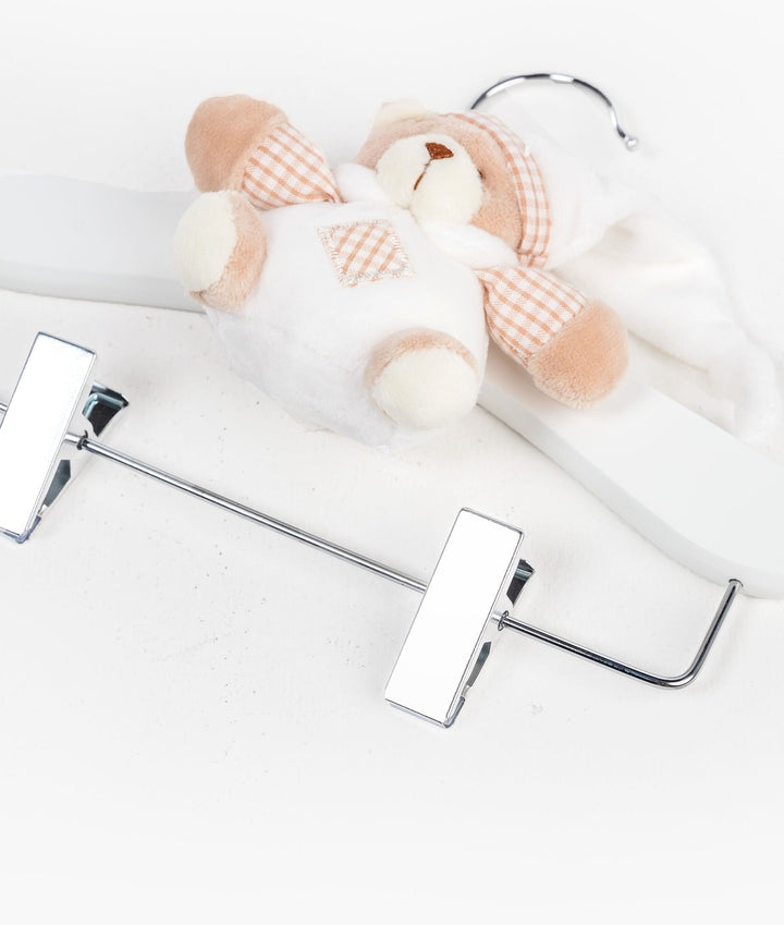 White and beige wooden hanger with clips
