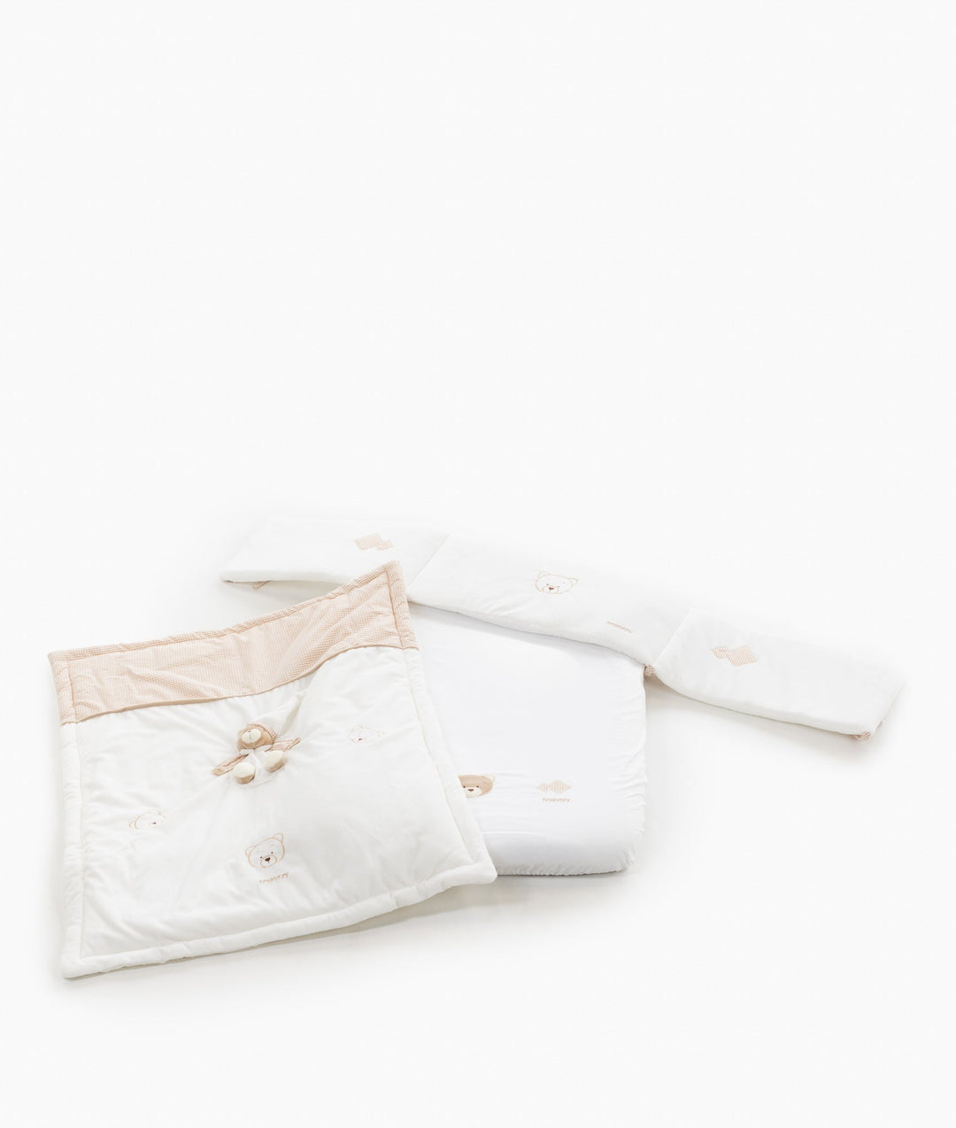 White and beige baby bassinet bedding