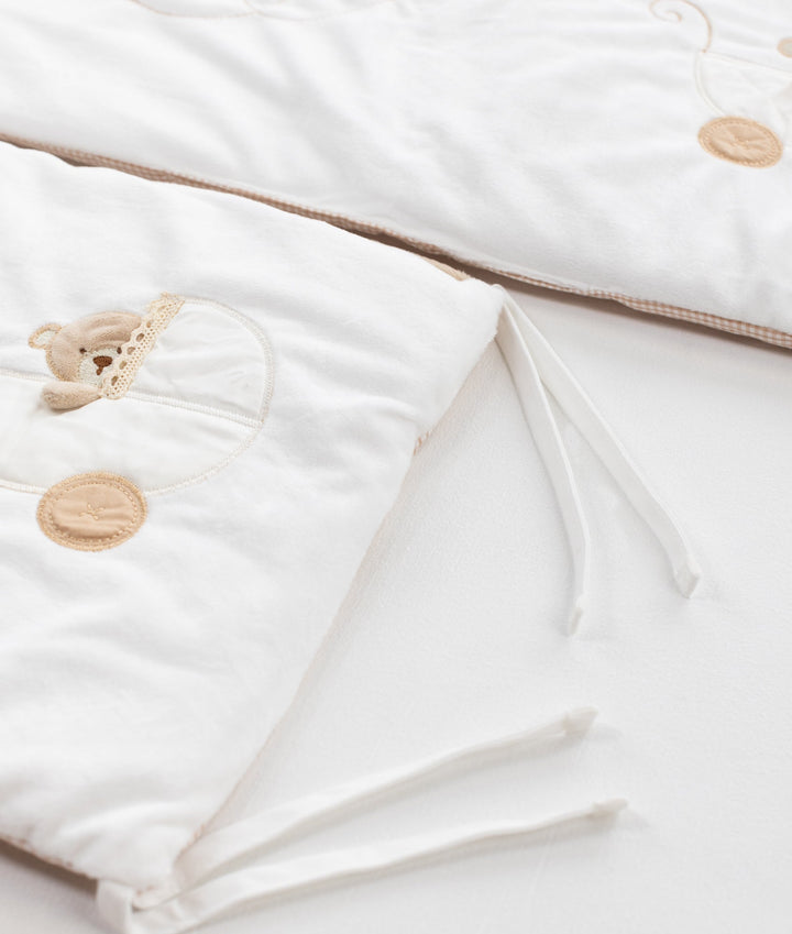 White and beige cot bumper set for baby cot