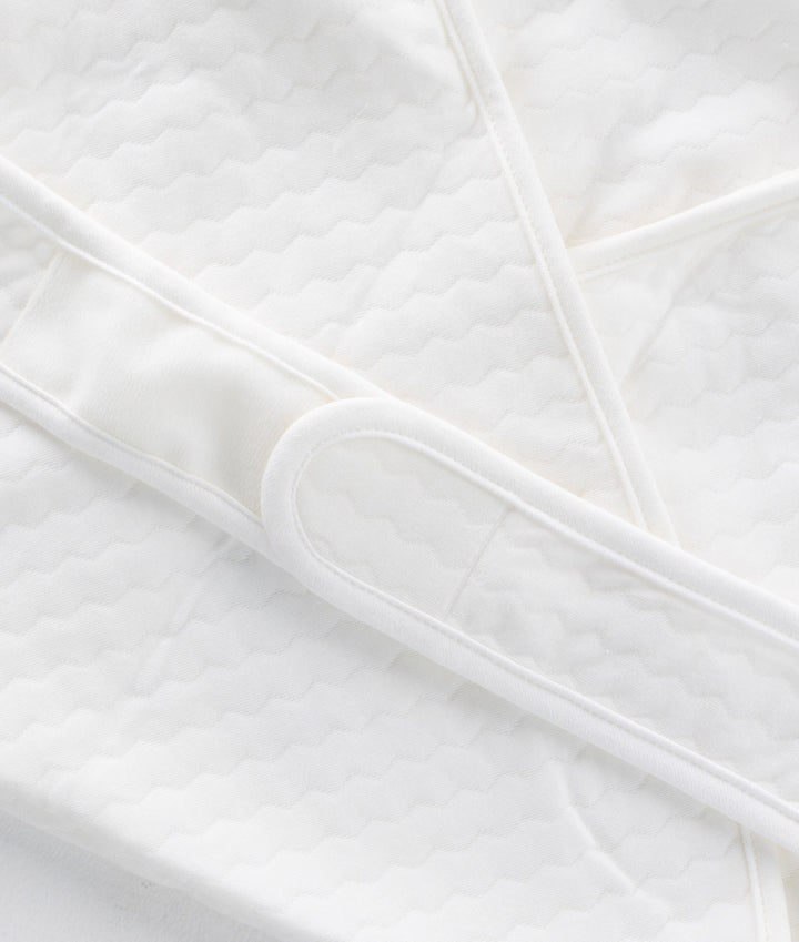 White and beige newborn swaddle blanket